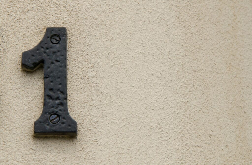 Number 1 address sign on a wall