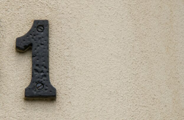 Number 1 address sign on a wall